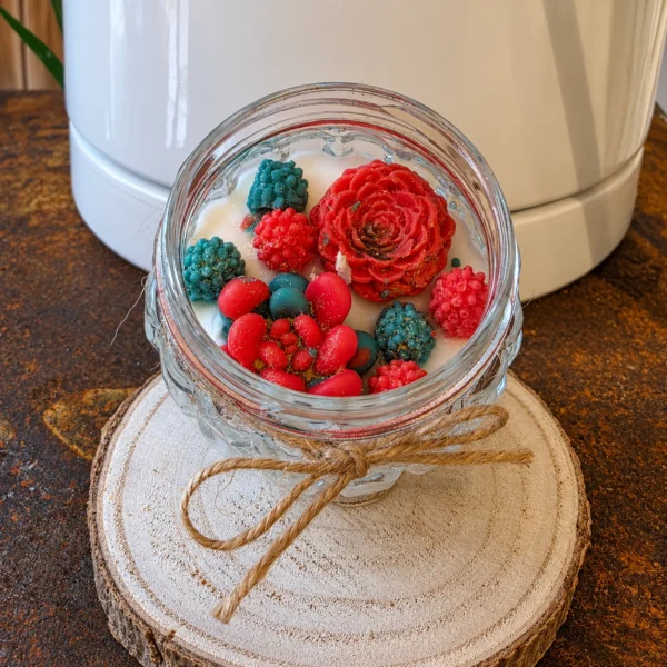 Bougie décorative Rubis Émeraude aux fleurs rouges et vertes